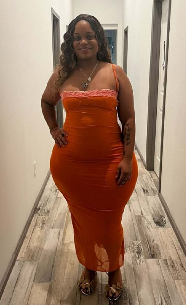 Thick Curvy model in orange dress