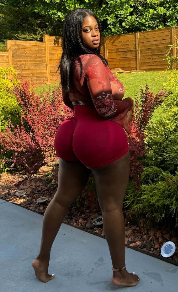 Curvy African girl in red legging shorts